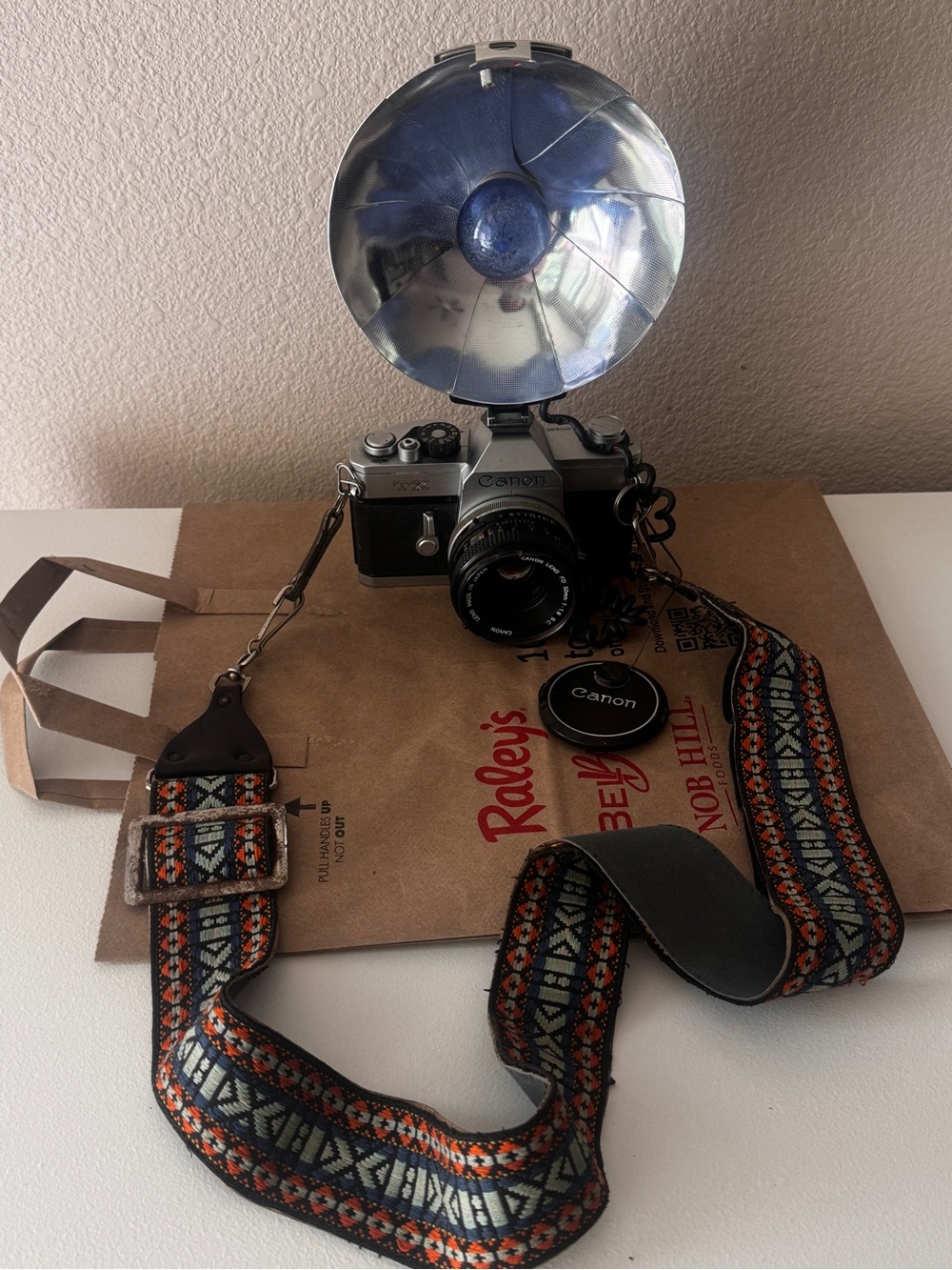 Canon Film Camera with Blue Flash Reflector and Patterned Orange-Accent Strap
